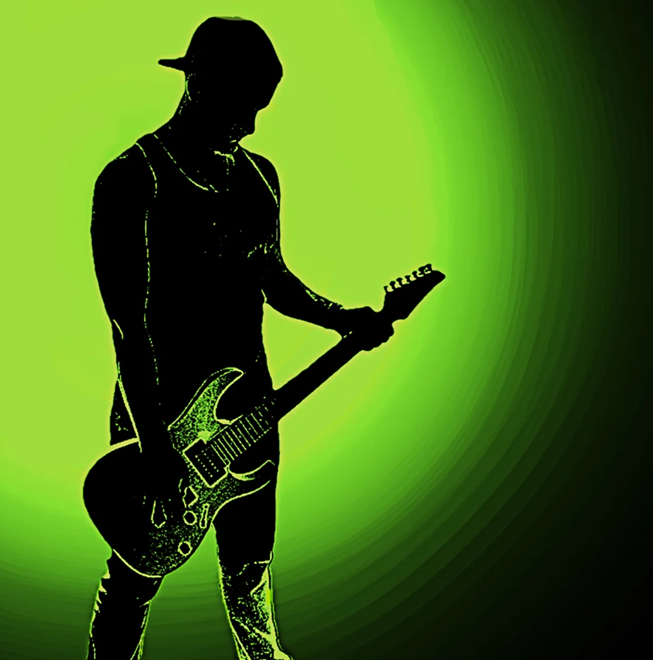 Silhouette of a guitarist against a green glow